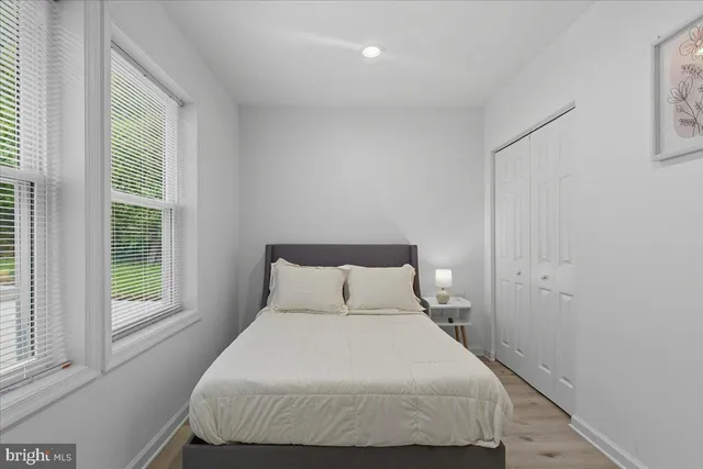 a bedroom with a bed and window