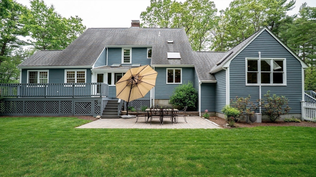 142 Baker Street Walpole, MA 02081 - Photo 39 of 42 a front view of house with yard and outdoor seating