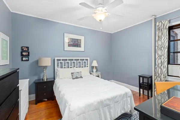 a bedroom with a bed and a table in it