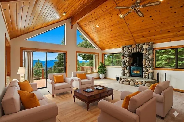 a living room with furniture a large window with outer view