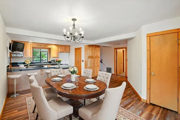 a view of a dining room with furniture window and outside view