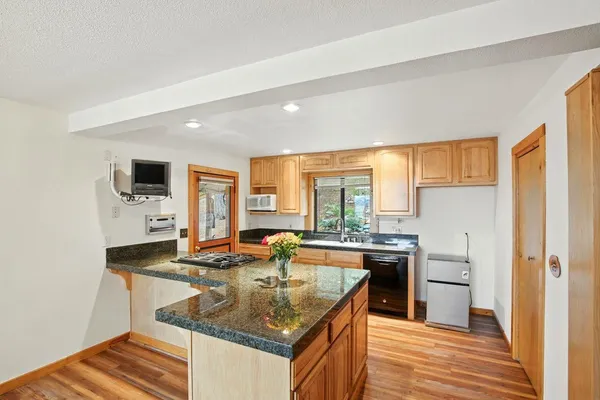 a kitchen with a stove a sink and a refrigerator