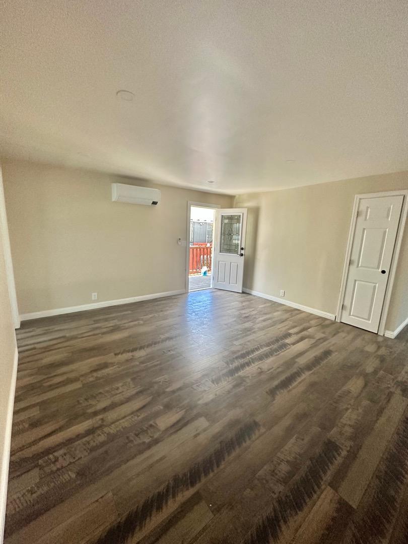 2151 Oakland Road, Unit 246 San Jose, CA 95131 - Photo 2 of 12 a view of an empty room with wooden floor