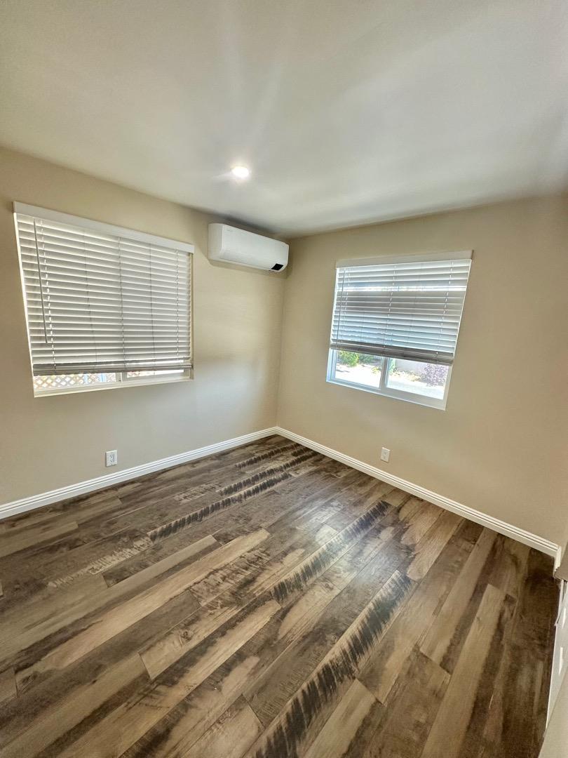 2151 Oakland Road, Unit 246 San Jose, CA 95131 - Photo 8 of 12 a view of empty room with wooden floor and fan