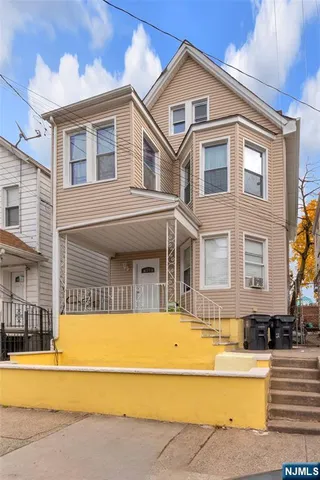 a front view of a house with a swimming pool