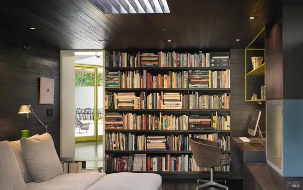 a work room with furniture and a window