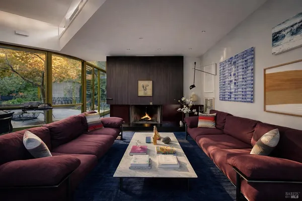 a room with lots of furniture and wooden floor