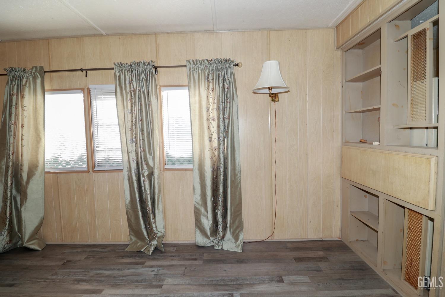 Undisclosed Address Wofford Heights, CA 93285 - Photo 18 of 26 a view of a room with wooden floor and a ceiling fan