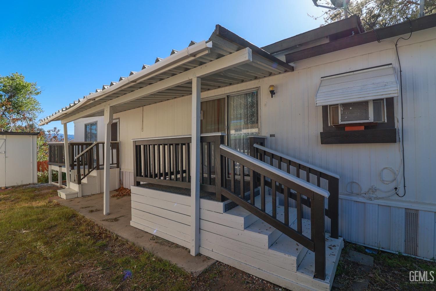 Undisclosed Address Wofford Heights, CA 93285 - Photo 4 of 26 a view of a house with wooden deck front of house