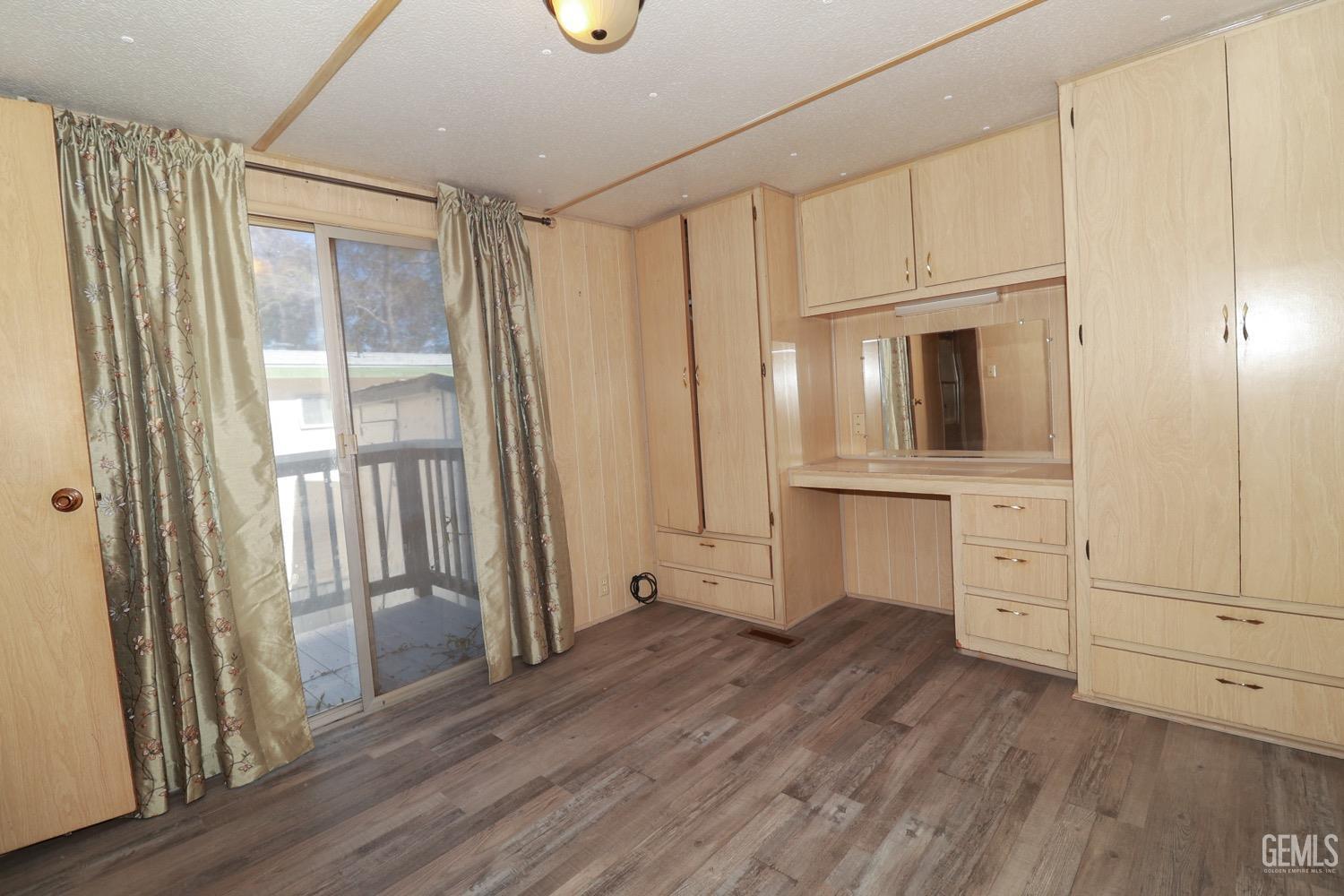 Undisclosed Address Wofford Heights, CA 93285 - Photo 8 of 26 a view of cabinets and wooden floor