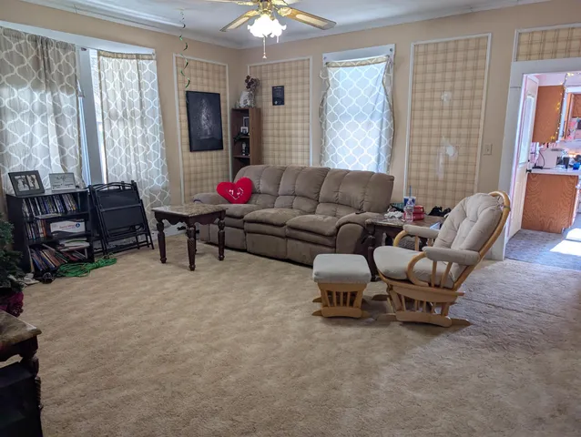 a living room with furniture and a window
