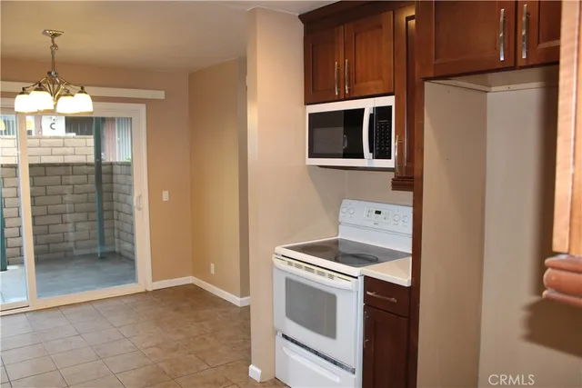 a kitchen with a stove and a refrigerator