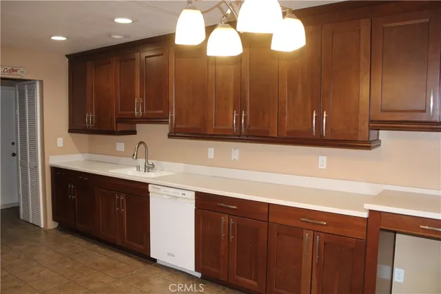 a kitchen with a sink and cabinets