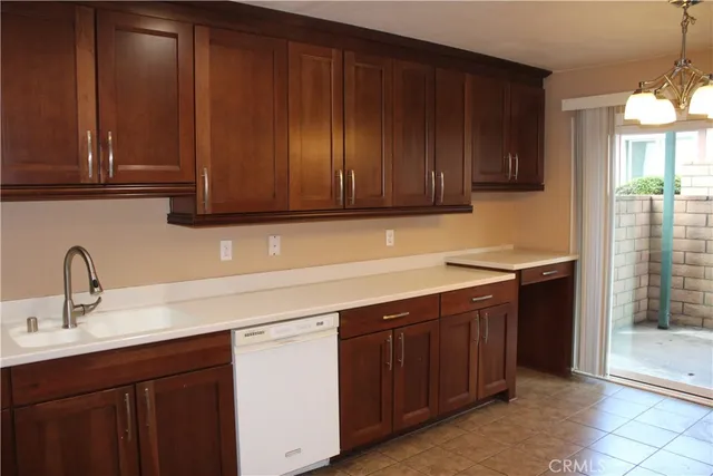 a kitchen with wooden cabinets