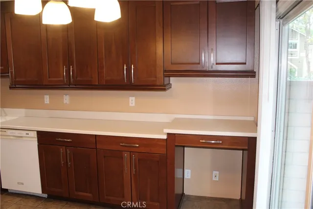 a kitchen with cabinets and white appliances