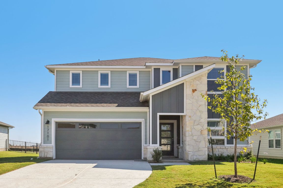 17101 Lomond Way Pflugerville, TX 78660 - Photo 1 of 1 a front view of a house with a yard