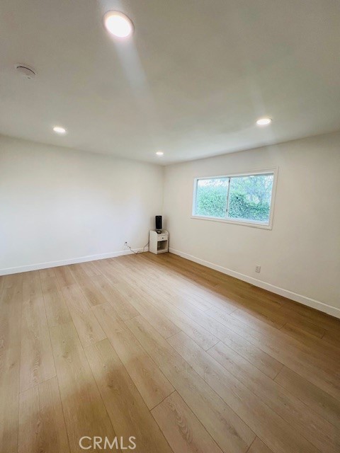 1135 Lockhaven Drive Brea, CA 92821 - Photo 29 of 35 an empty room with wooden floor and windows