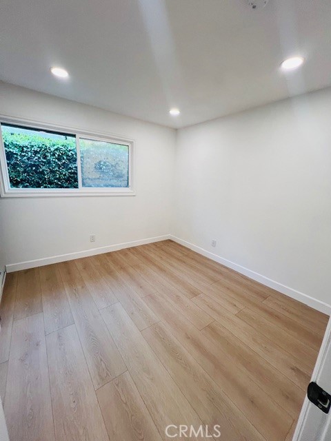 1135 Lockhaven Drive Brea, CA 92821 - Photo 31 of 35 an empty room with wooden floor and windows