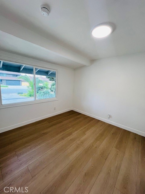 1135 Lockhaven Drive Brea, CA 92821 - Photo 32 of 35 an empty room with wooden floor and windows