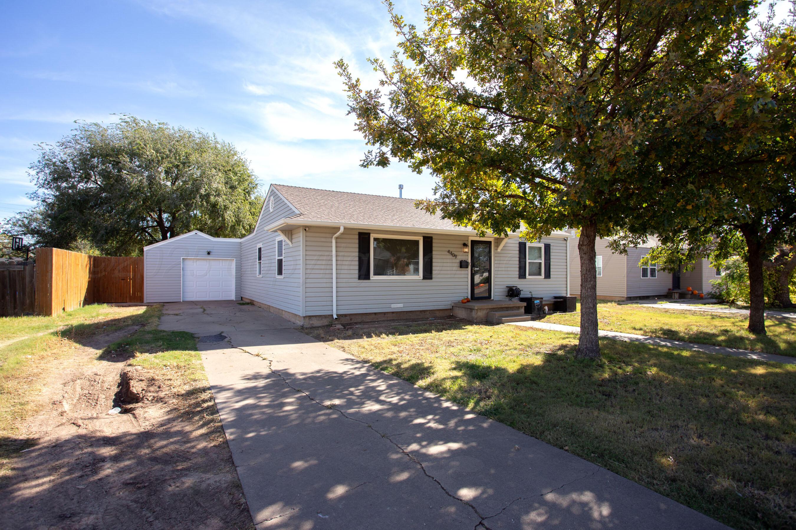4409 South Lipscomb Street Amarillo, TX 79110 - Photo 2 of 23 a house with trees in the background