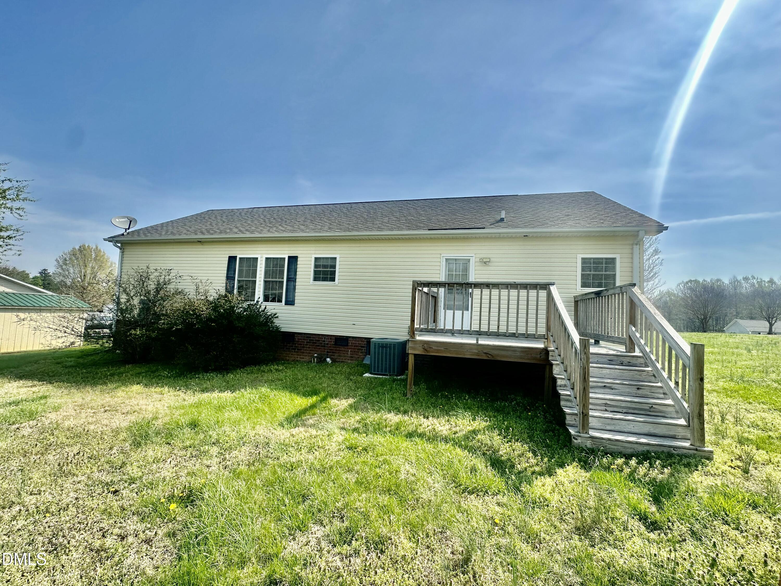 155 Collin Drive Roxboro, NC 27574 - Photo 19 of 20 a view of a house with a yard porch and wooden fence