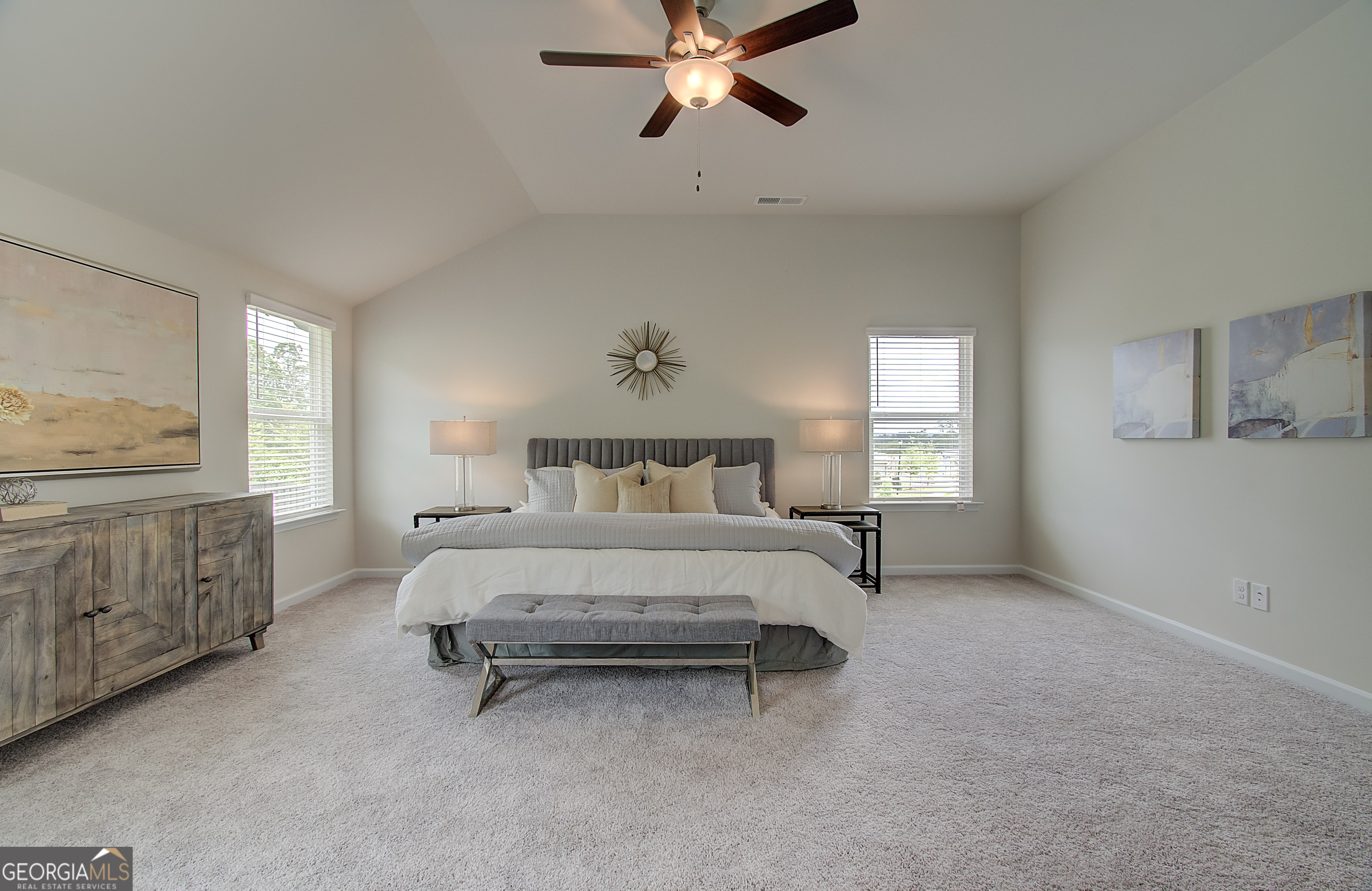 477 Collier Mls Road, Unit 20 Lawrenceville, GA 30045 - Photo 28 of 36 a spacious bedroom with a bed and a chandelier