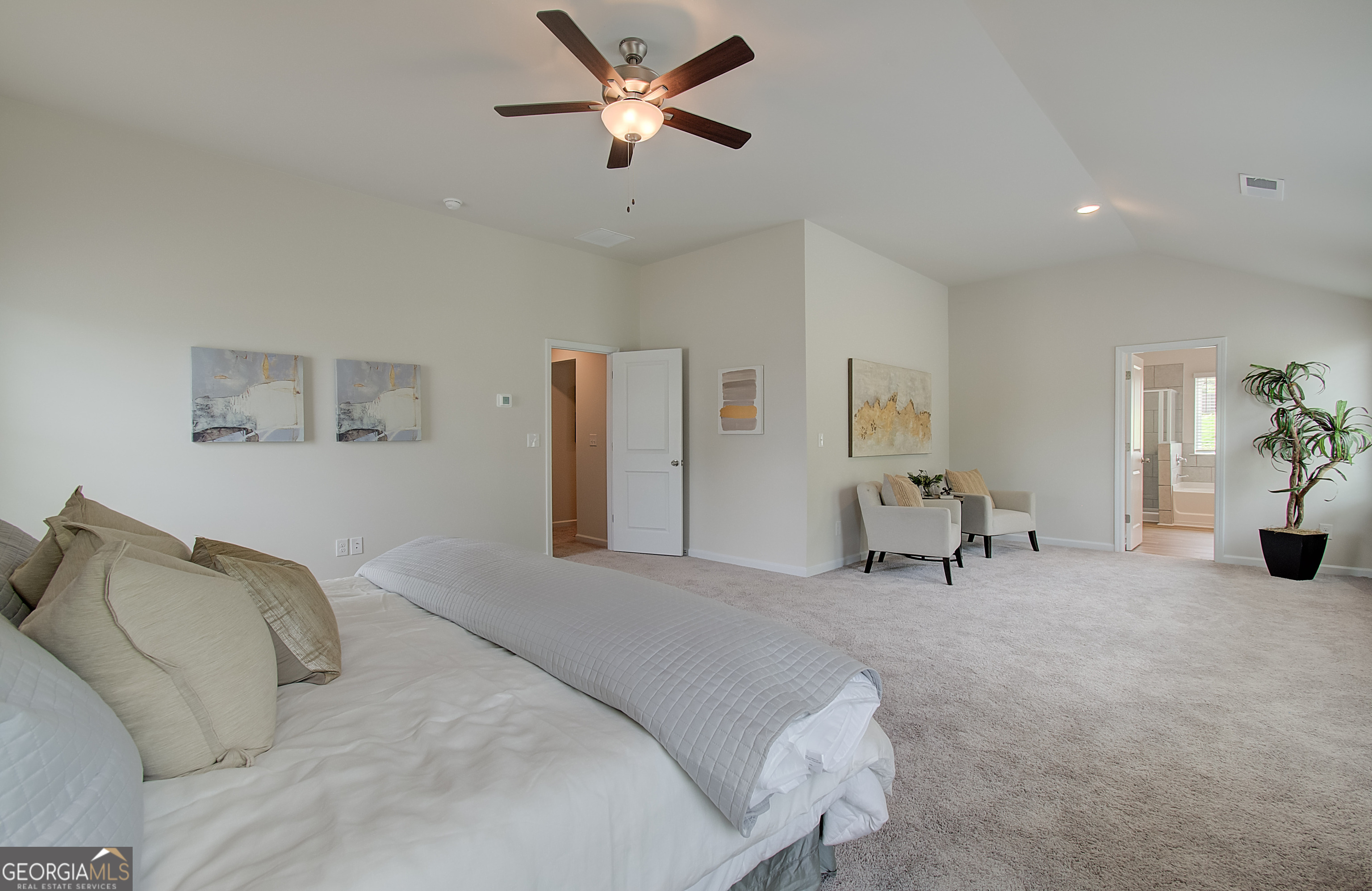 477 Collier Mls Road, Unit 20 Lawrenceville, GA 30045 - Photo 29 of 36 a bedroom with a bed and a chair