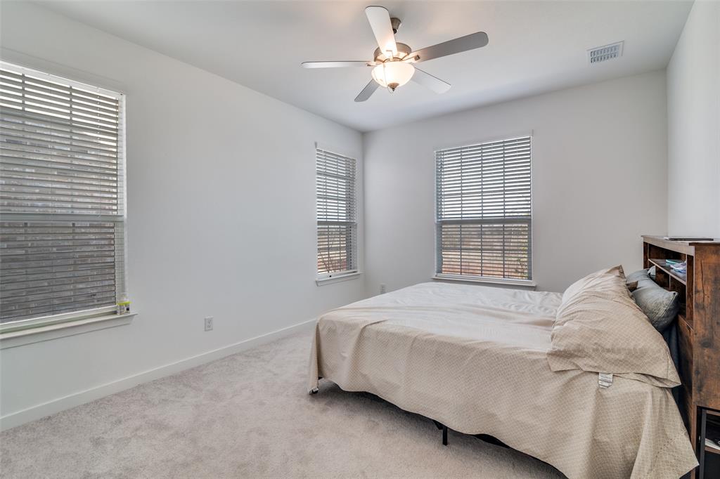 4016 Daisy Holw Loop Mesquite, TX 75181 - Photo 11 of 32 a bedroom with a bed and a window