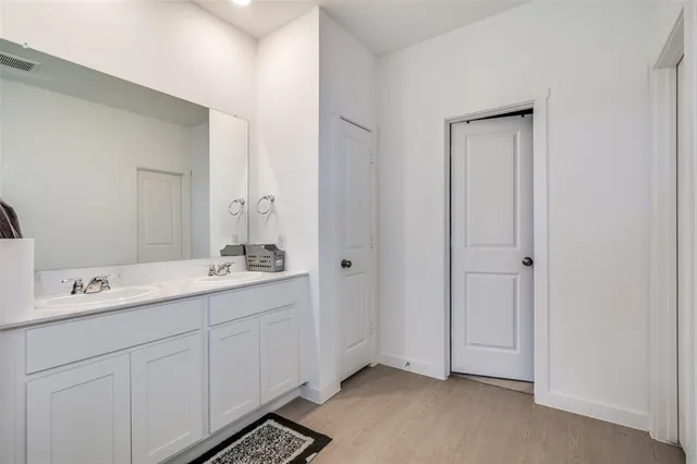 an aerial view of a house with outdoor space and lake view