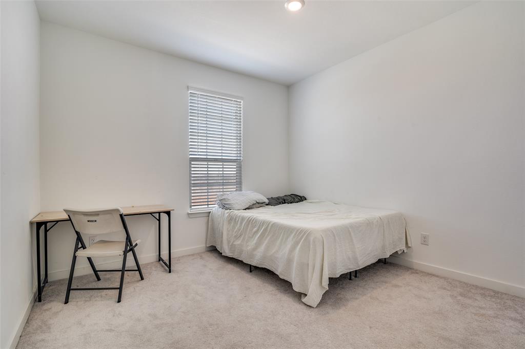 4016 Daisy Holw Loop Mesquite, TX 75181 - Photo 15 of 32 a bedroom with a bed chair and a window