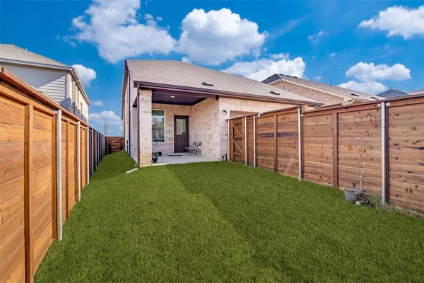 a view of a backyard with plants