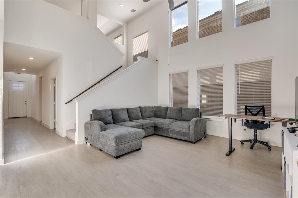 4016 Daisy Holw Loop Mesquite, TX 75181 - Photo 2 of 32 a living room with furniture and a fireplace