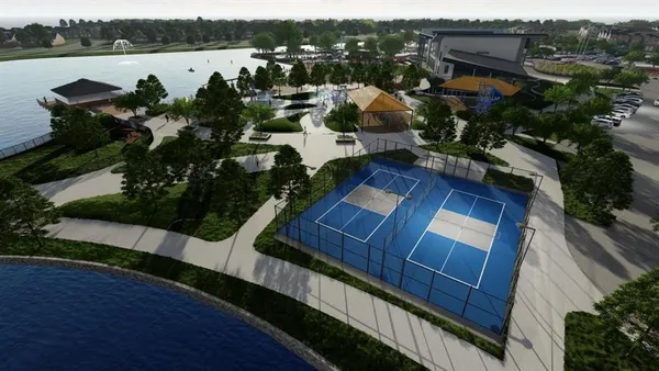 an aerial view of a house with outdoor space and lake view