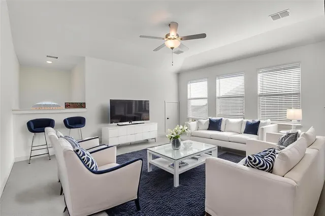 a bedroom with a table and chairs