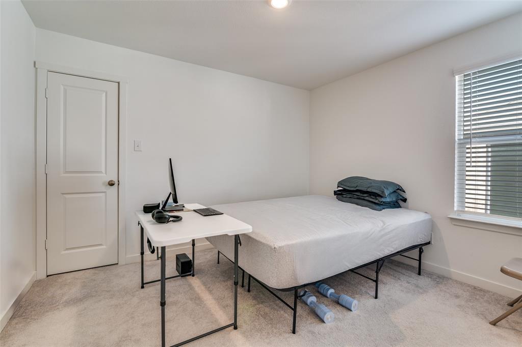 4016 Daisy Holw Loop Mesquite, TX 75181 - Photo 9 of 32 a bedroom with a table and chairs