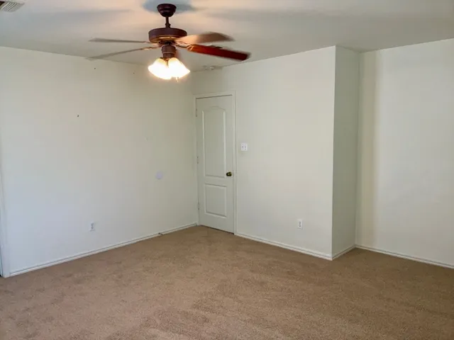 a view of a chandelier fan in a room