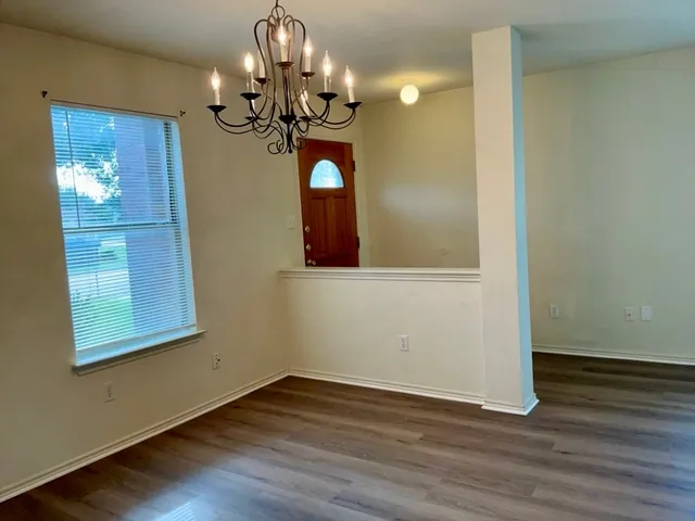a view of a livingroom with wooden floor
