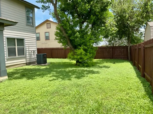 a view of a back yard of the house