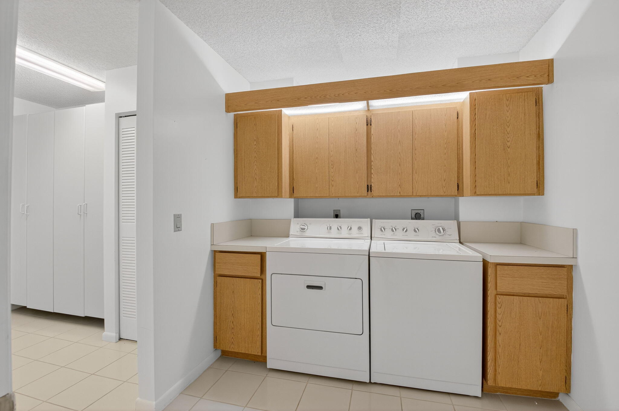 6193 Balboa Circle, Unit 403 Boca Raton, FL 33433 - Photo 16 of 25 a utility room with dryer and washer