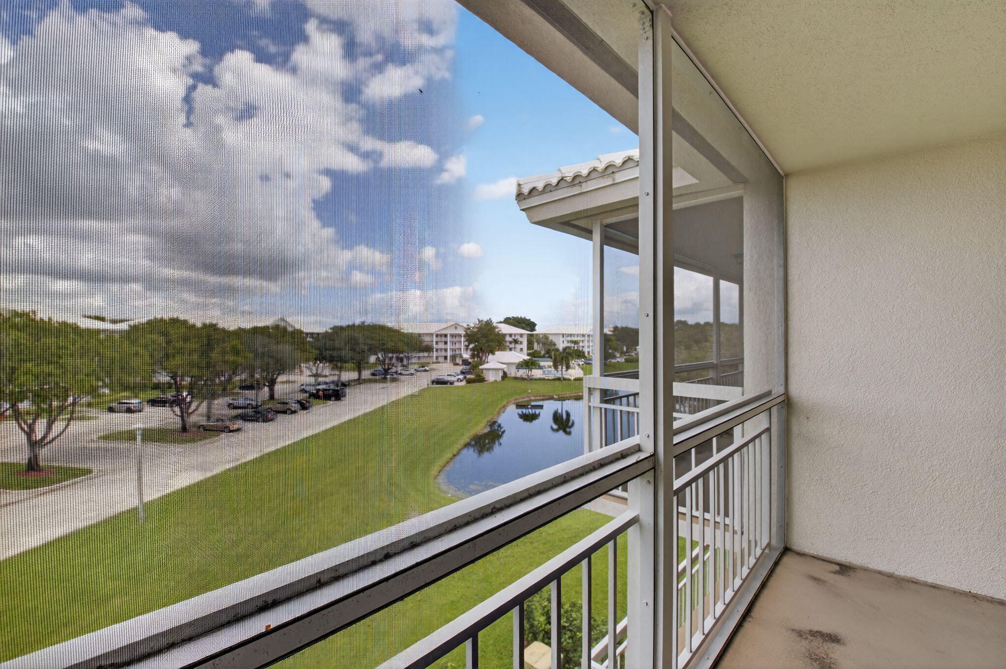 6193 Balboa Circle, Unit 403 Boca Raton, FL 33433 - Photo 19 of 25 a view of swimming pool from a balcony