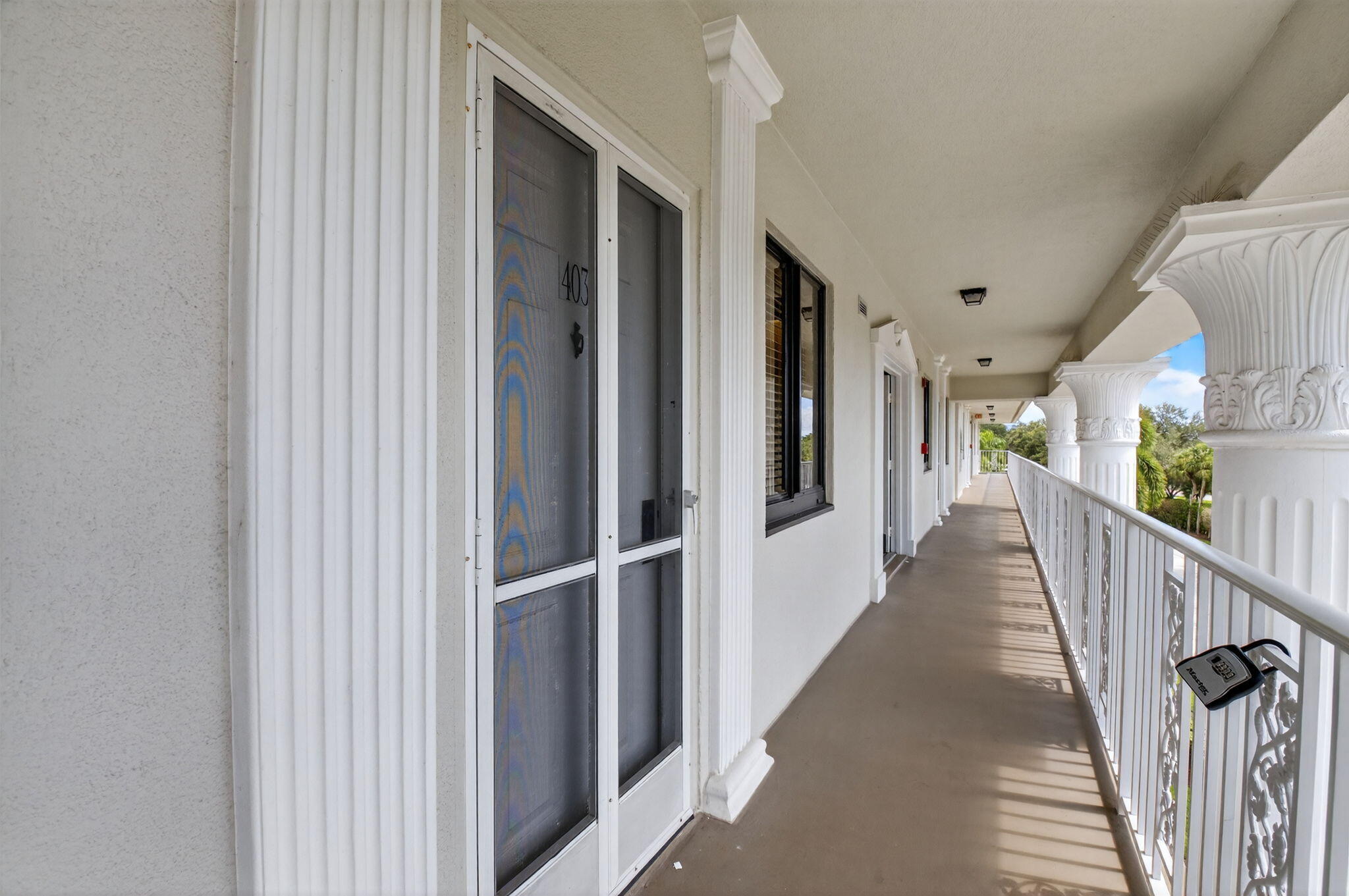 6193 Balboa Circle, Unit 403 Boca Raton, FL 33433 - Photo 25 of 25 a view of a hallway with wooden floor and entryway