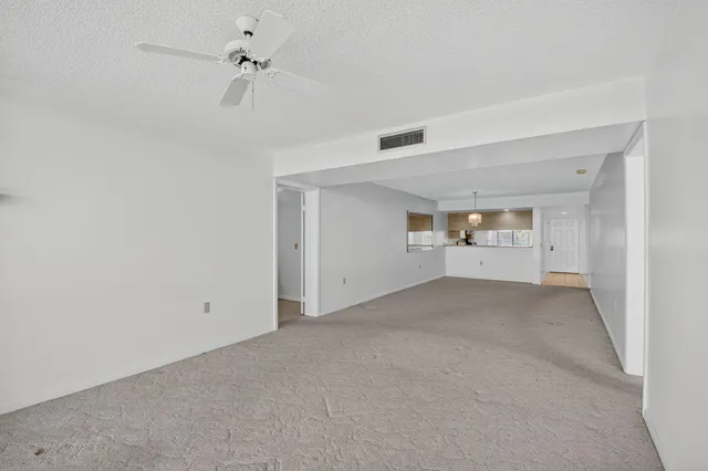 a room view with wooden floor and bathroom view