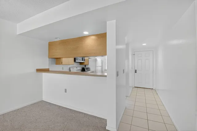 a kitchen with stainless steel appliances granite countertop a sink and cabinets