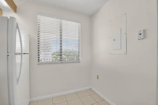 a view of a big room with closet and chandelier fan