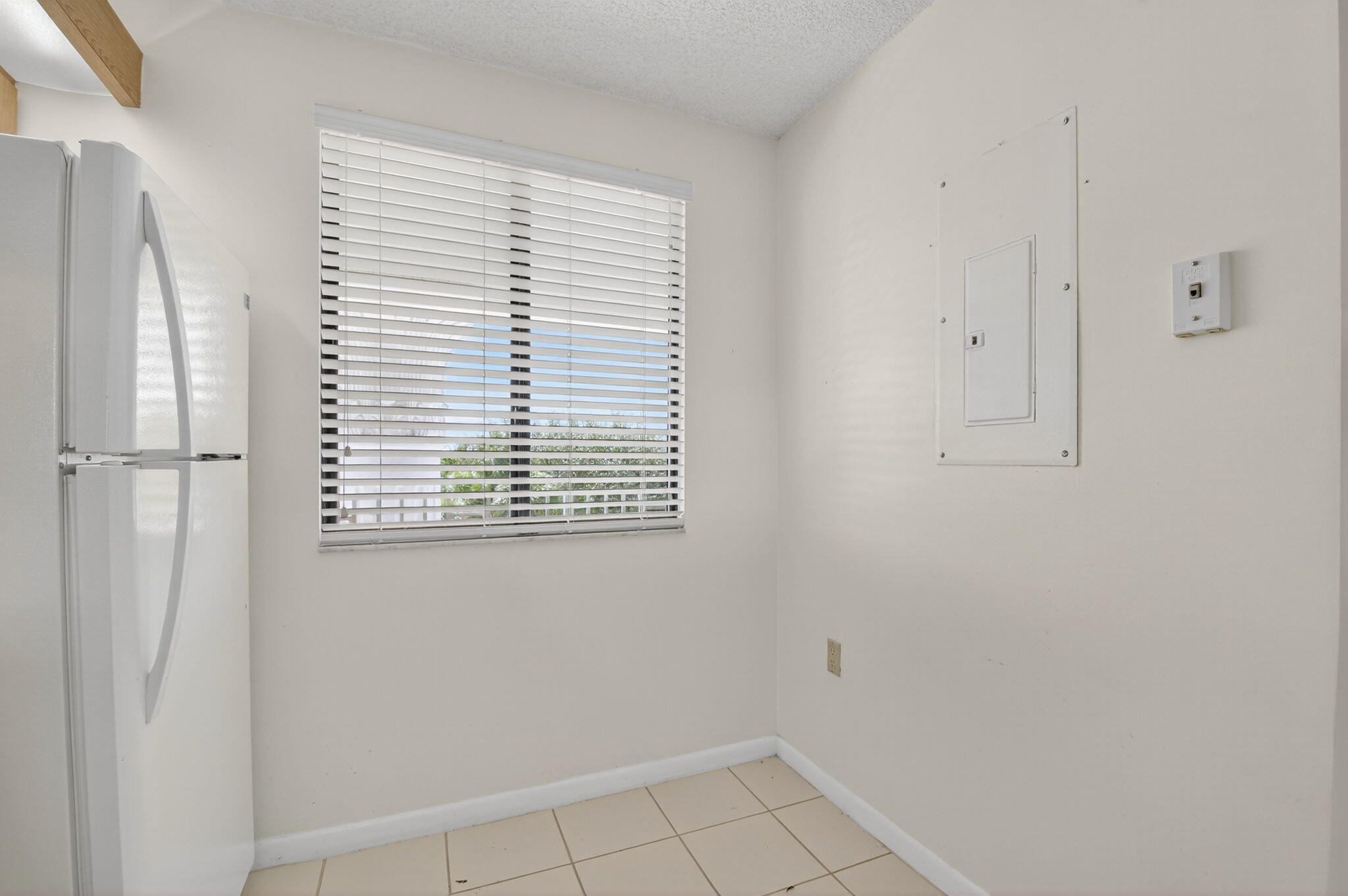 6193 Balboa Circle, Unit 403 Boca Raton, FL 33433 - Photo 10 of 25 a view of an empty room with a window