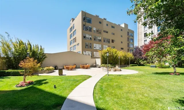 a view of a swimming pool with a yard