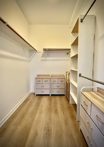 a view of a room with cabinet dryer and washer