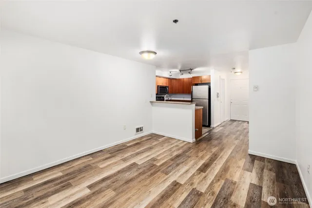 a view of kitchen and wooden floor
