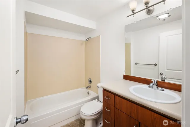 a bathroom with a sink a toilet and a bathtub