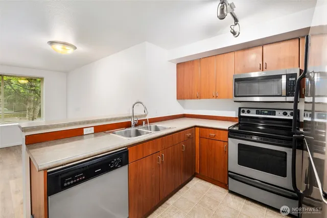 a kitchen with a stove and a sink